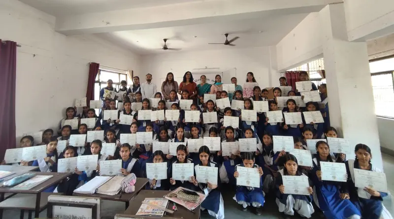 Students holding their certificates
