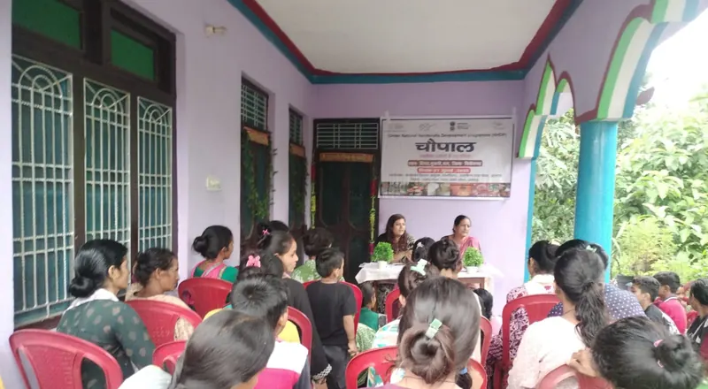 Women attending a community chaupal in Kumaon