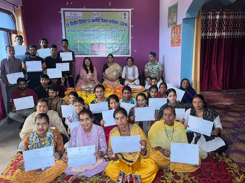 Participants holding certificates after a 25-day Design & Technical Development Workshop
