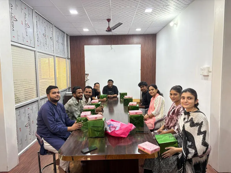 The Alphine team seated around a conference table